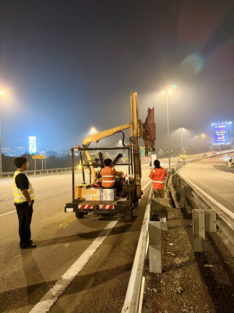 Guardrail crew and plant during night operations