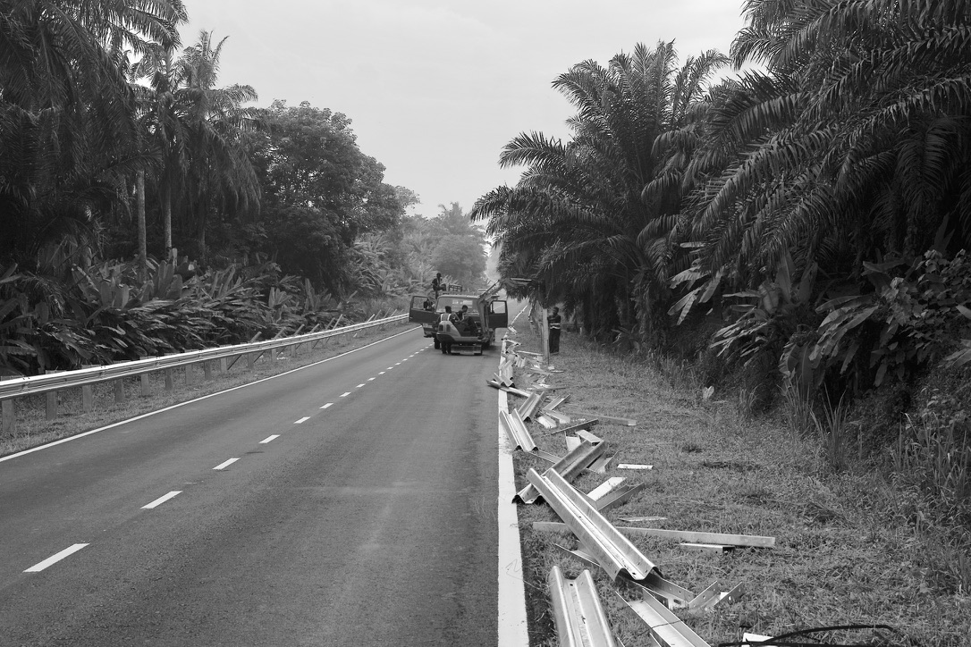 Roadside guardrail alignment in black and white